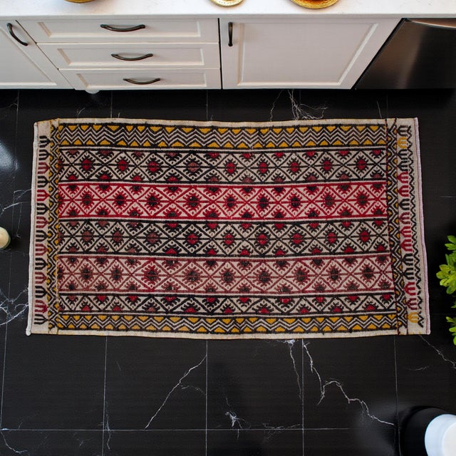 Embodying the authentic flat-weave aesthetic, this exquisite piece carries the vibrant, nomadic soul of Anatolian textile...