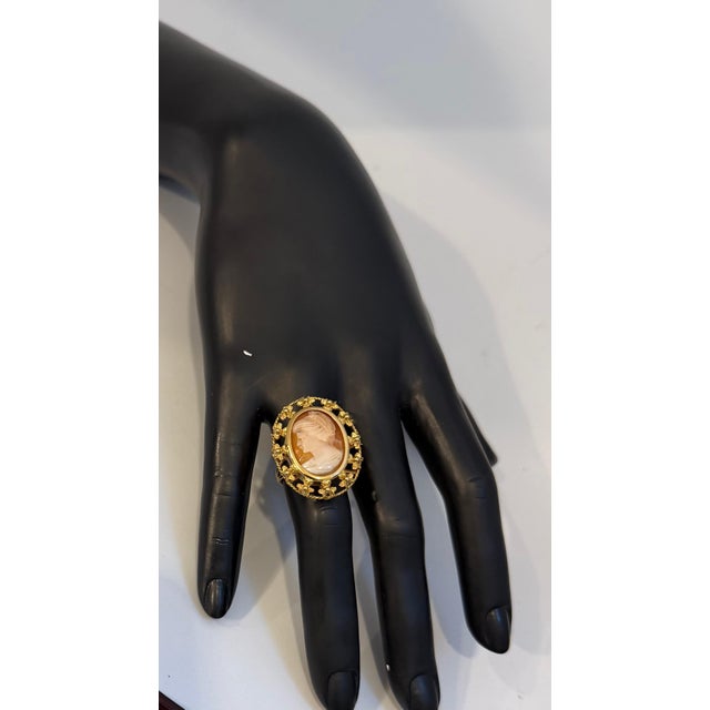 A gorgeous pink carved lady in yellow gold vintage cameo ring featuring a shell carved Victorian inspired lady cameo...
