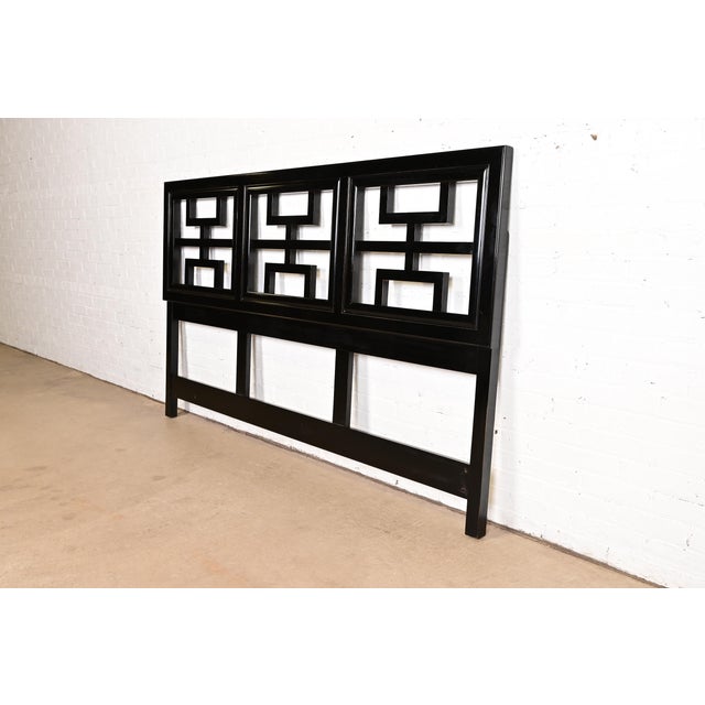 A gorgeous mid-century modern Hollywood Regency Chinoiserie black lacquered king size headboard By Century Furniture USA,...