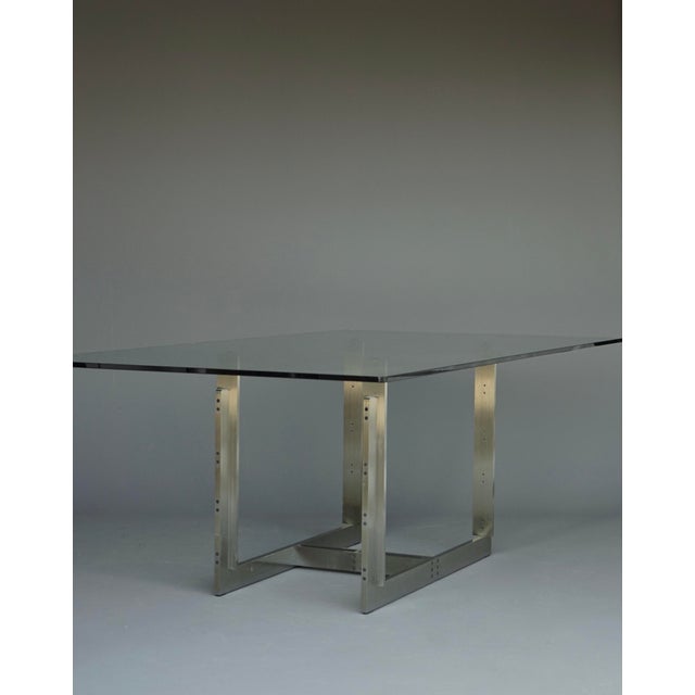 Sarpi table designed by Carlo Scarpa for Simon Gavina with frame in brushed stainless steel. Held together with visible...