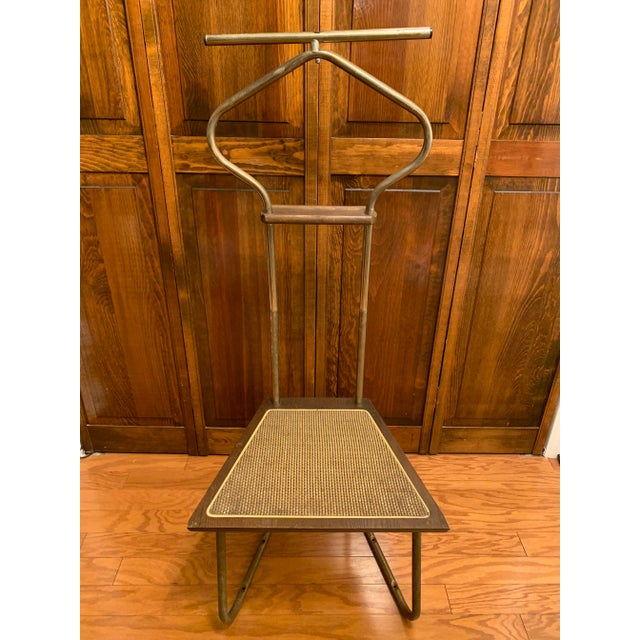 This is a beautiful mid century men's suit valet butler with solid seat. Brass finish with a lot of patina. As you can see...