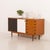 This vintage sideboard from the 1970s shows the quality of mid-century carpentry with solid teak details combined with...