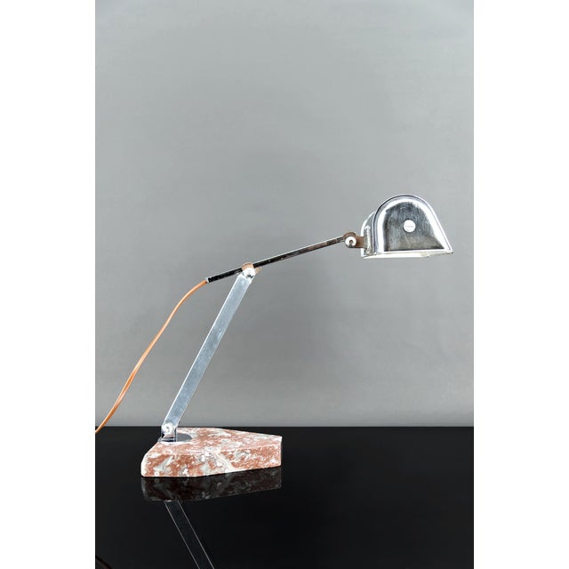 Add a touch of elegance to your interior with this exceptional Art Deco desk lamp, crafted in France around 1930. A...