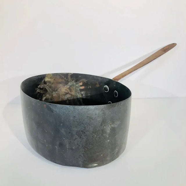 This is a classically rustic French copper cooking pot with iron handle. I suspect it is from the mid 1800s. It is showing...