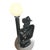 Table lamp from the 1980s with black glazed ceramic and a white glass globe shade. By Buthe Keramik It depicts a detective...