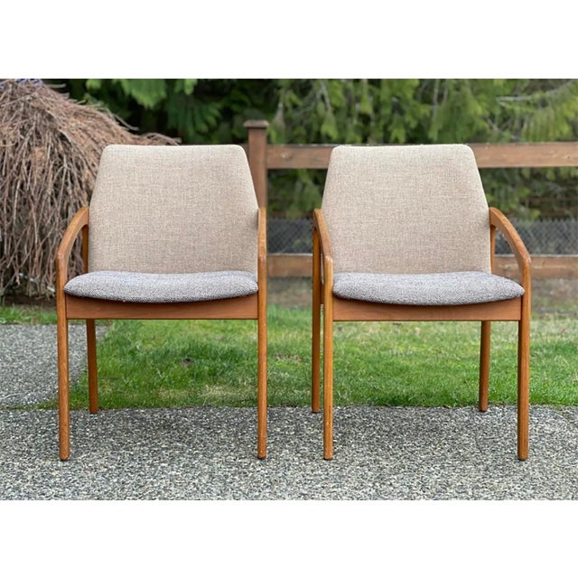 Pair of teak dining chairs designed by Henning Kjaernulf for Korup Stolefabrik model 23, circa 1960, Denmark. Solid teak...