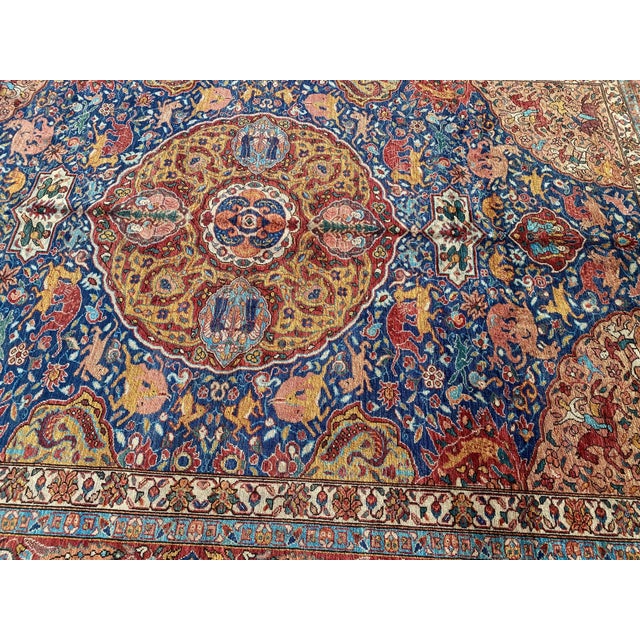 This vintage Persian - Style carpet showcases the celebrated "hunting design" tradition — a richly detailed genre tracing...
