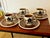A spectacular set of four cups and four saucers in glazed earthenware, from the belgian manufacturer boch la louvière,...