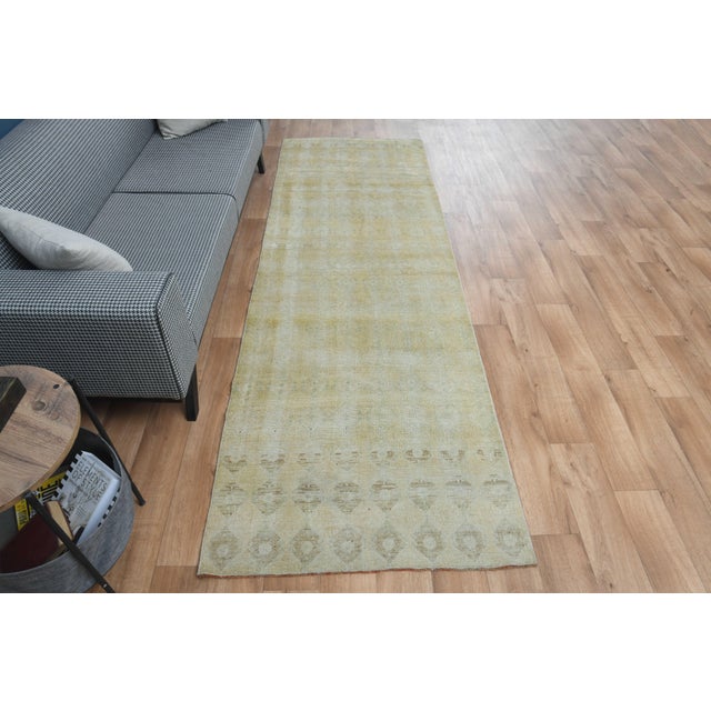 This vintage hand-knotted area rug is a semi-antique vintage area rug. The '70s Eastern region of Anatolian's unique rug...