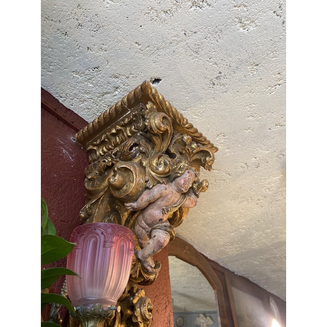 Unique hand carved corbels on chestnut wood. The painting restored