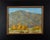 In "Fall Apart," vibrant autumnal trees stand in striking contrast to the rugged mountains in the background, capturing...