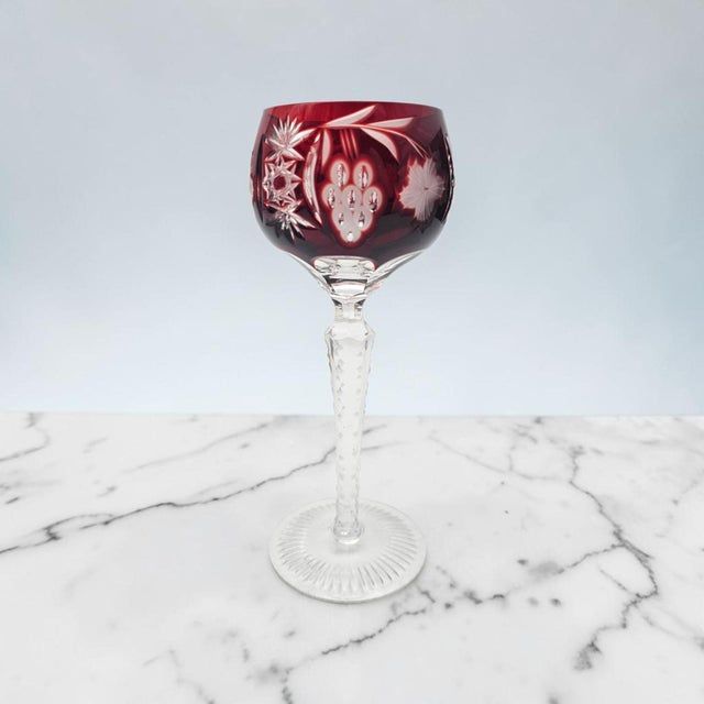 This Ajka Crystal Marsala Hock wine goblet was hand-blown and hand-cut in Hungary during the late twentieth century....