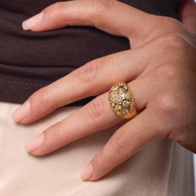 This vintage French ring dazzles with an array of fine round brilliant diamonds, each chosen for its crisp white color and...