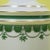 A classic pair of colonial-style table lamps in green and ivory, with timeless turned silhouettes. The two-tone finish...