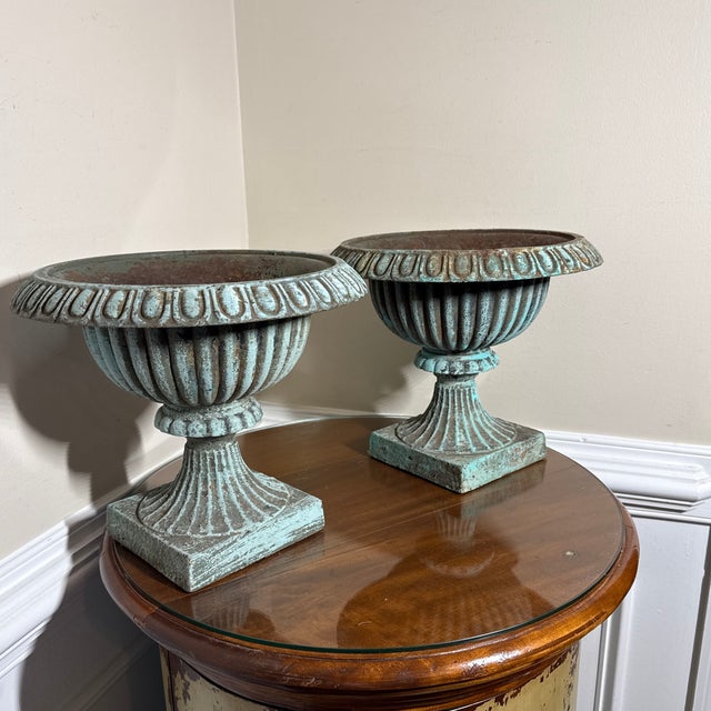 These classical pedestal urn planters feature a lovely aged green finish that gives them an authentic antique French...