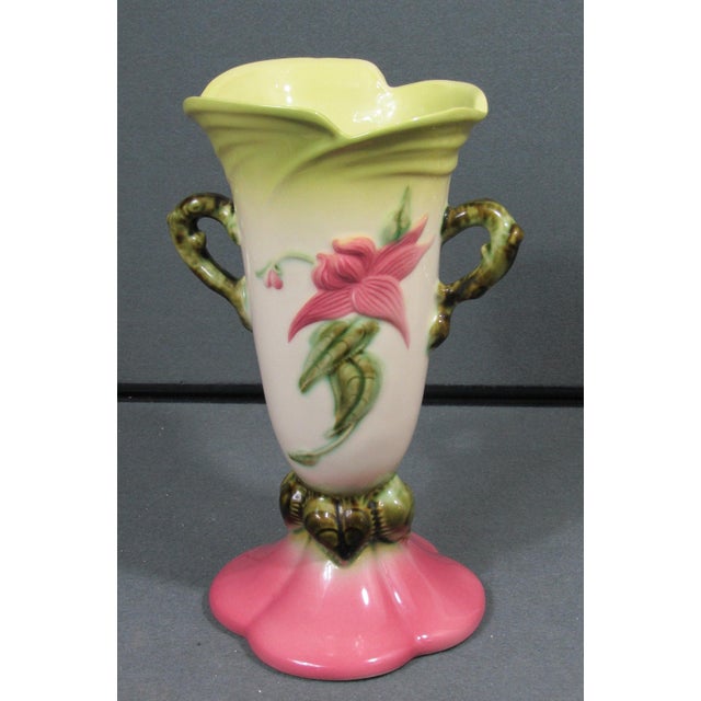 A striking circa 1952–1954 Hull Art Pottery Woodland W-18 vase, finished in a vibrant high-gloss palette of chartreuse,...