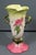 A striking circa 1952–1954 Hull Art Pottery Woodland W-18 vase, finished in a vibrant high-gloss palette of chartreuse,...