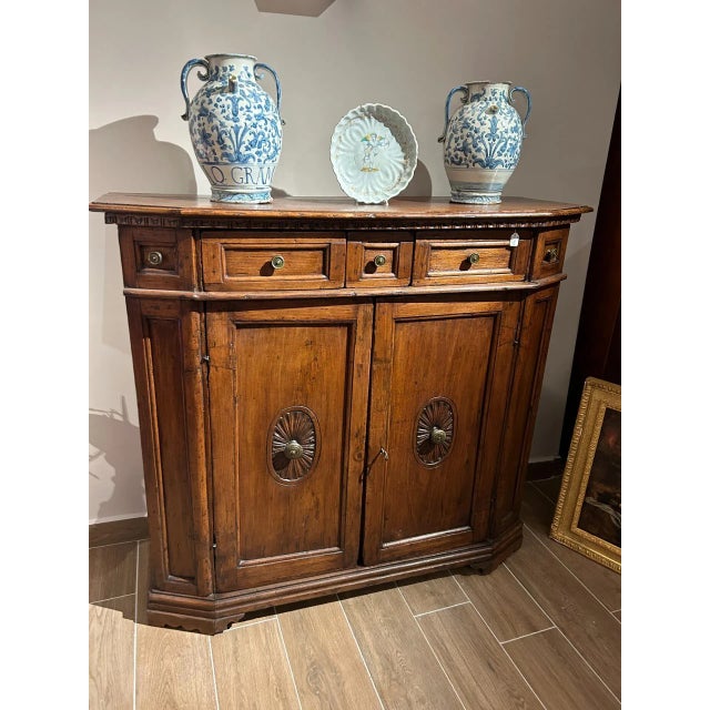 Beautiful poplar wood cabinet, with a walnut top, two doors, and three drawers. Probably from the north-central region,...
