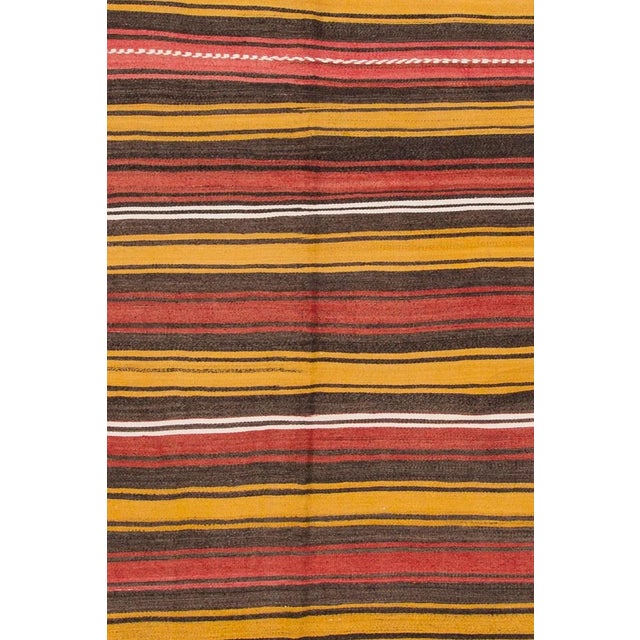Hand-woven vintage Turkish Kilim with a striped design. This piece has magnificent detailing and great colors, it would be...