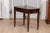 An Italian walnut side table from circa 1890 with oval top, single drawer and cylindrical tapering legs. This Italian...