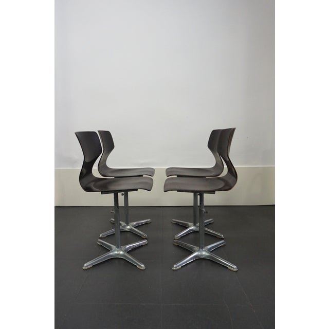 Set of four thermoformed Pagholz chairs with metal star bases, designed by Adam Stegner for Flototto in the 1970s. They...