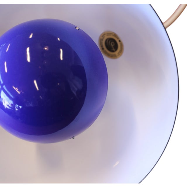 The flowerpot pendant vp1 in cobalt blue enameled metal is a timeless ceiling lamp that combines minimalist design with a...