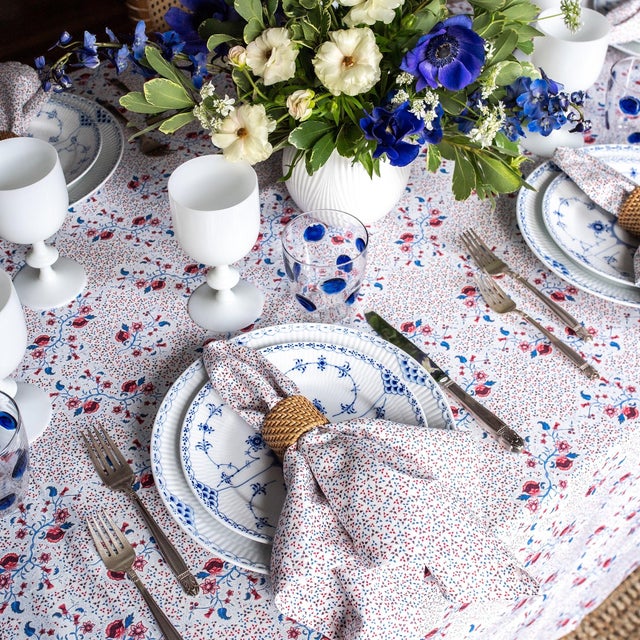 Set a beautiful table with this brand new, never used, rectangular tablecloth in a burgundy, cerulean blue, and white...