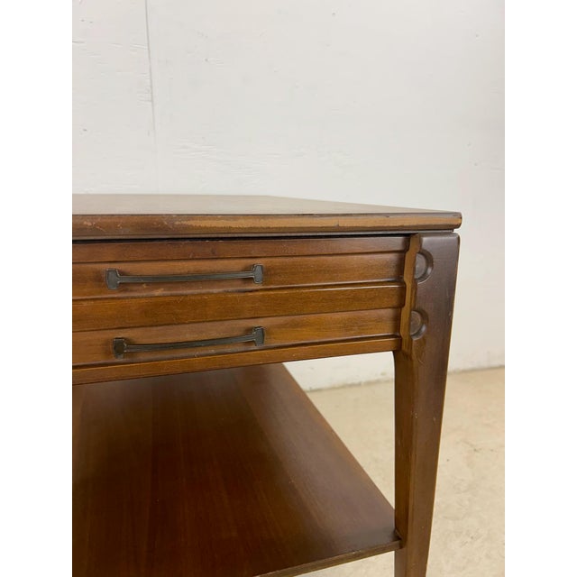 This mid century modern end table by Mersman features hardwood construction, single dovetail drawer, tall tapered legs,...
