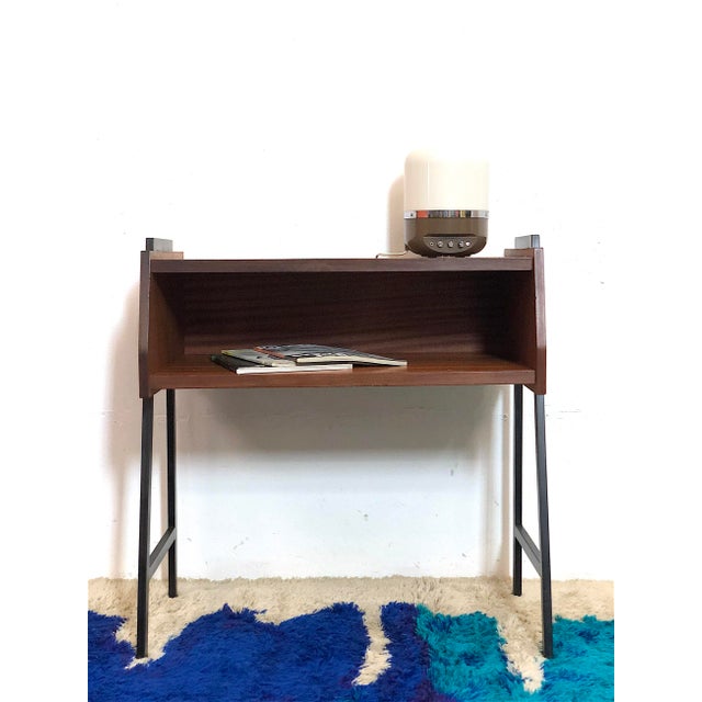 1960s Italian-made furniture, entirely in teak veneer, metal frame with the typical 1960s design. Conservative restoration...