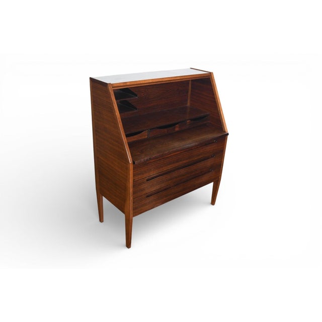 This lovely Danish modern secretary desk in rosewood was Attributed to Kai Kristiansen for HJN Møbler. The large desk...