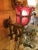 A magical antique wall sconce having elaborate brass bracket with putti and a scalloped cranberry glass shade. Rewired and...