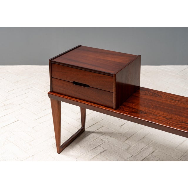 Denmark, ca. 1960s. A scarce and smartly designed console table by Kai Kristiansen for Aksel Kjersgaard. Features rosewood...
