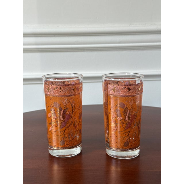 This stunning set of mid-century highball glasses is statement making. The hand painted pheasant and foliage design with...