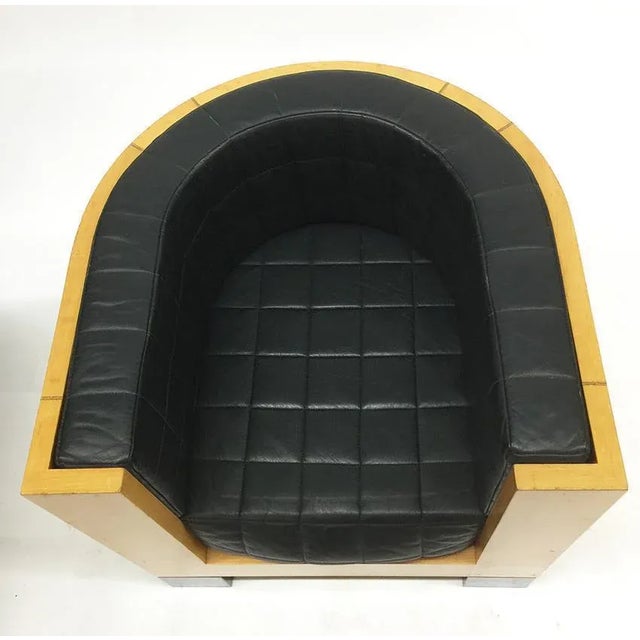 Designer Oswald Mathias Ungers (1926-2007) Half round curved beech wood veneered "Sfera" armchair with black leather seat...