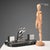 Art Deco inkwell with bird and metal cruet holder on a black marble base. Glass cruets. This piece is attributed to the...