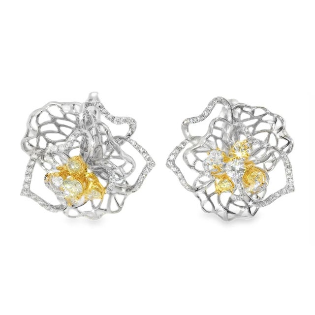 Crafted in 18K white and two-tone gold , each earring measures 7/8 inch in diameter and the pair weighs 12.1 grams ,...