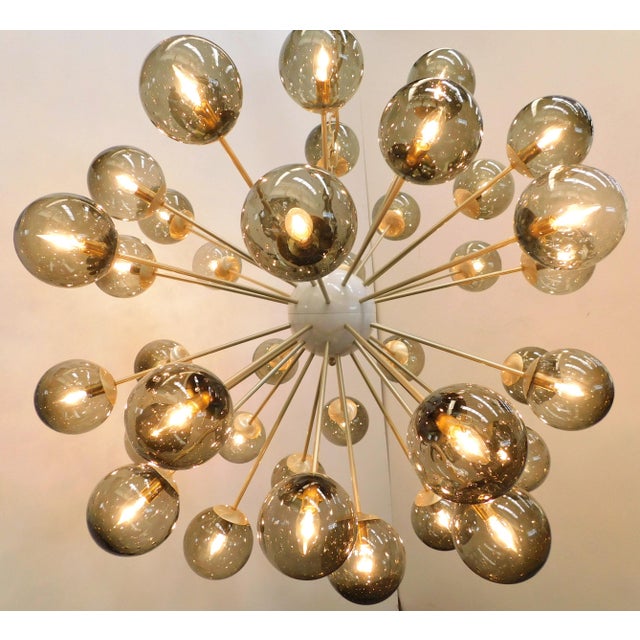 Italian sputnik chandelier with 40 smoky Murano glass globes carefully hand blown with bubbles inside the glass using...