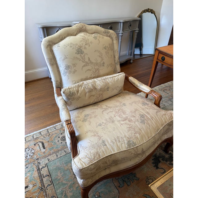 A rare, gorgeous pair of French Provincial Louis XV-style lounge chairs, crafted by Baker Furniture in the USA circa...