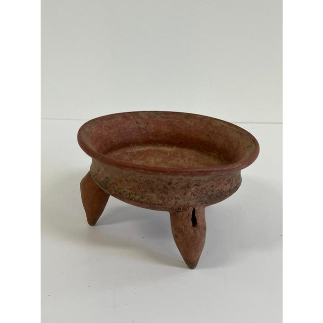 This antique tripod pottery vessel, dating from the late 19th to early 20th century (circa 1880s–1920s), is hand-formed...