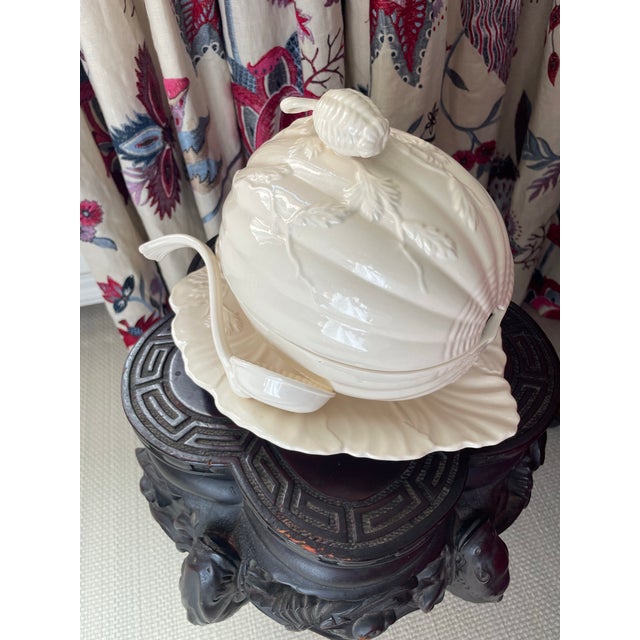 This beautiful tureen is in the shape of a melon. It comes with a spoon. The base site on a leaf shaped plate and the top...