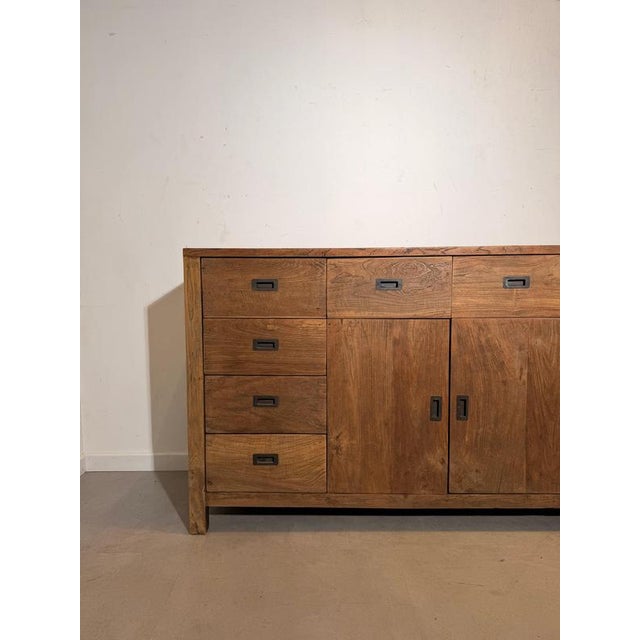 Impressive and highly functional solid wood sideboard, combining warm natural tones with a clean, timeless design. This...