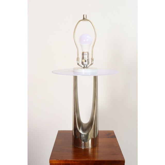 Sculptural chrome table lamp with a wishbone or hairpin-form and white enameled-metal cap by Laurel Lamp Company (ca....
