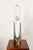 Sculptural chrome table lamp with a wishbone or hairpin-form and white enameled-metal cap by Laurel Lamp Company (ca....