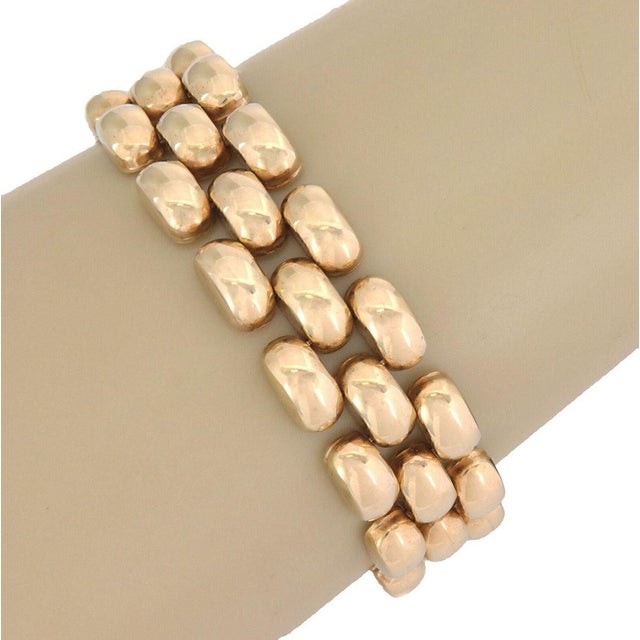 This Three Row 14k Yellow Gold Bar Link Bracelet is a classic piece of vintage jewelry that exudes elegance and...