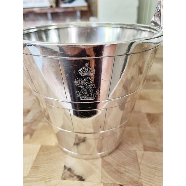 A lovely antique circa 1914 heavy silver plated ice bucket from the Cunard steamship Line! This bucket is in excellent...
