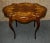 Antique (1900s) Turtle Top Shaped Table has a Renaissance Revival/ Victorian Style. The Wood is Mahogany. Inlaid Mahogany...