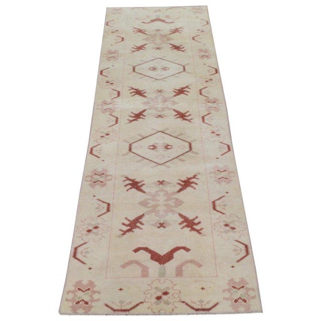 Hand-knotted with care using traditional rug-making techniques, this wool rug blends timeless craftsmanship with a modern...