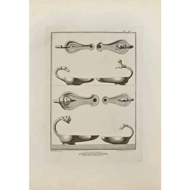Oil Lamp with Heads of Animals from "Antiquities of Herculaneum" is an etching on paper realized by Ferdinando Campana in...