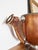 A beautiful antique circa 1910s copper trophy with deer antler handles, engraved to read: 1st Prize Black Langshans...