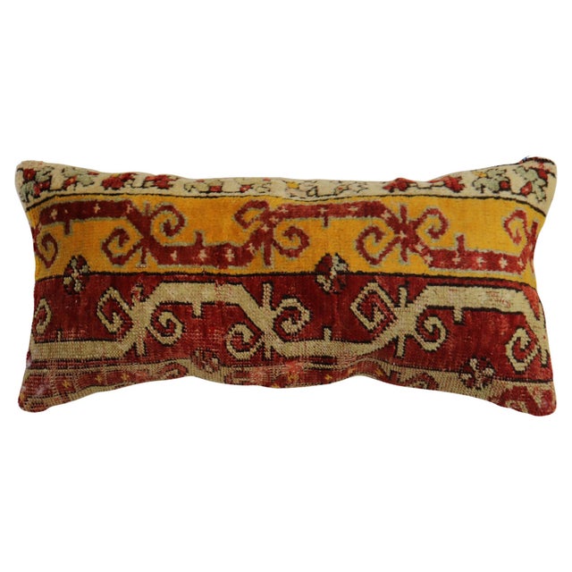 Pillow made from an early 20th-century Turkish ghiordes rug. Measures: 12" x 24".